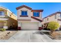 Two-story house with a beige exterior and a two-car garage at 4788 Frankfurt Ct, Las Vegas, NV 89147