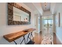 Elegant entryway features a modern console table and mirror at 322 Karen Ave # 2007, Las Vegas, NV 89109