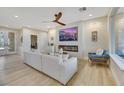 Light-filled living room with comfortable seating and a built-in fireplace at 4660 Fiore Bella Blvd, Las Vegas, NV 89135