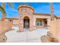 Elegant entryway with stone accents and double doors at 5527 Breecher Ave, Las Vegas, NV 89131