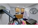 Compact kitchen area with wood cabinets and appliances at 5527 Breecher Ave, Las Vegas, NV 89131