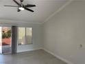 Bright living room featuring vaulted ceilings, neutral walls, light wood-look floors and sliding doors to the outside at 8516 Spyrun Dr, Las Vegas, NV 89134