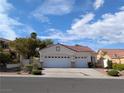 Traditional one story home with a two car garage and a concrete driveway at 9728 Echo Hills Dr, Las Vegas, NV 89134