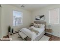 Airy bedroom with ample natural light and stylish, minimalist decor at 6485 Arrow Cottage Ct, Las Vegas, NV 89130