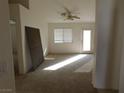 Bright living room featuring a fireplace and access to the backyard at 1113 Cloudy Day Dr, Henderson, NV 89074