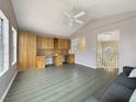 Upstairs bonus room includes built-in shelves and cabinets with ceiling fan at 504 Landra Ln, Henderson, NV 89015