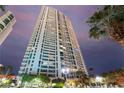 Modern high-rise building featuring balconies and well-manicured landscaping at 322 Karen Ave # 3707, Las Vegas, NV 89109