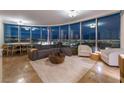 Open-concept living area with a sofa, city view, and dining area at 322 Karen Ave # 3707, Las Vegas, NV 89109