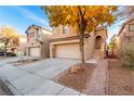 Two-story house with attached garage and landscaped yard at 5317 Welch Valley Ave, Las Vegas, NV 89131