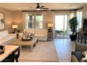 Spacious living room with a light and airy feel and access to backyard at 114 Antler Square Ln, Henderson, NV 89011