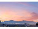 Stunning sunset view overlooking city lights and mountain range at 16 Via Stefano, Henderson, NV 89011