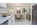 Modern kitchen with white cabinets and quartz countertops at 1830 N Buffalo Dr # 1091, Las Vegas, NV 89128