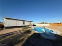 Relaxing backyard oasis featuring a kidney-shaped pool at 2028 College Pl, Las Vegas, NV 89156