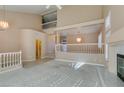 High-ceilinged living room with a fireplace and loft view at 2412 Eagleridge Dr, Henderson, NV 89074