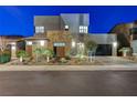 Beautiful home showcasing modern architecture and desert landscaping at 6800 Equinox Cliff St, Las Vegas, NV 89135