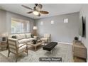 Airy living room with neutral decor, modern furnishings, and ample natural light at 6953 Graceful Cloud, Henderson, NV 89011