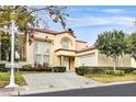 Elegant two-story home featuring a well-kept lawn and a spacious two car garage at 8390 Carmel Ridge Ct, Las Vegas, NV 89113