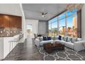 Contemporary living room with floor-to-ceiling windows, an open floor plan, and a modern kitchen at 353 E Bonneville Ave # 313, Las Vegas, NV 89101