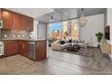 Sun-filled living area with a modern kitchen, large windows, and comfortable furnishings at 353 E Bonneville Ave # 313, Las Vegas, NV 89101