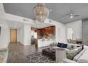 Bright, open living space with modern chandelier, stainless steel appliances, and comfortable seating at 353 E Bonneville Ave # 313, Las Vegas, NV 89101