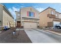 Beige two-story house with a two-car garage and red shutters at 6271 Port Astoria Ct, Las Vegas, NV 89122