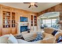 Elegant living room with built-in shelving and fireplace at 9103 Alta Dr # 701, Las Vegas, NV 89145