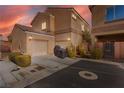 Two-car garage with a covered patio area at 9494 Alma Ridge Ave, Las Vegas, NV 89178