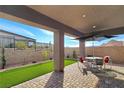 Covered patio with seating area and view of the mountains at 144 Juliette Pointe Ln, Henderson, NV 89011