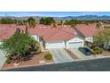 Aerial view of a residential neighborhood with well-maintained homes and mountain views at 5683 Whale Watch St, Las Vegas, NV 89113