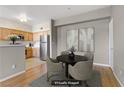 Dining area includes a round table, four chairs, and views of the adjacent kitchen at 7701 Himalayas Ave # 104, Las Vegas, NV 89128