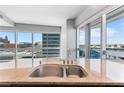 Modern kitchen with granite countertops, stainless steel sink, and city views at 4471 Dean Martin Dr # 801, Las Vegas, NV 89103