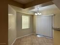 Spacious dining area with tile floors and window at 4725 Basilicata Ln # 102, North Las Vegas, NV 89084