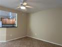 Bright living room with tile floors and kitchen access at 4725 Basilicata Ln # 102, North Las Vegas, NV 89084