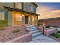 Inviting townhome exterior featuring manicured landscaping and a welcoming entrance at 965 Nevada State Dr # 1101, Henderson, NV 89002