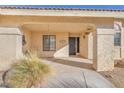 Covered entryway with tile flooring and potted plants at 1550 Desertaire Way, Las Vegas, NV 89110