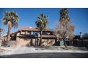 Two-story home with a double garage and desert landscaping at 2205 Alia Ct, Las Vegas, NV 89102