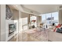 Bright living room with fireplace, city views, and modern furnishings at 2747 Paradise Rd # 2206, Las Vegas, NV 89109
