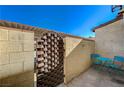 Small patio with blue metal table and chairs at 537 Kristin Ln, Henderson, NV 89011