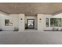 A modern home featuring a front entrance, and a paver driveway at 2401 Driftwood Dr, Las Vegas, NV 89107