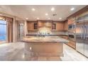 Gourmet kitchen with island and stainless steel appliances at 9101 Alta Dr # 1406, Las Vegas, NV 89145