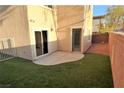 Small backyard with artificial turf and patio at 9869 Juno Hills St, Las Vegas, NV 89178