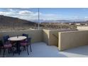 Private rooftop deck with mountain views and seating at 9869 Juno Hills St, Las Vegas, NV 89178