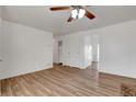 Bright living room with wood-look floors and ceiling fan at 120 Maple St, Henderson, NV 89015