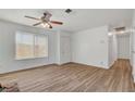 Living room with wood-look floors and ceiling fan at 120 Maple St, Henderson, NV 89015