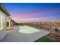 Relaxing kidney shaped pool with mountain views and beautiful sunset at 1928 Oliver Springs St, Henderson, NV 89052