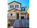 Two-story house with dark shutters, attached garage, and a small front yard at 10265 Franford Ct, Las Vegas, NV 89183