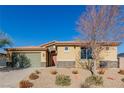 Single-story house with a stone facade and landscaped front yard at 10440 Irish Cliffs Ct, Las Vegas, NV 89149