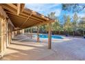 Inviting backyard with a refreshing pool and covered patio at 3335 W Mardon Ave, Las Vegas, NV 89139