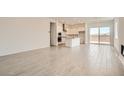 Open-concept living space with tile floors and a seamless transition to the kitchen at 104 Barkset Way, Henderson, NV 89011