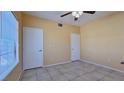 Bright bedroom with tile flooring and ample closet space at 2020 Rancho Lake Drive Dr # 205, Las Vegas, NV 89108